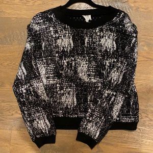 Very fancy shiny and black sweater!